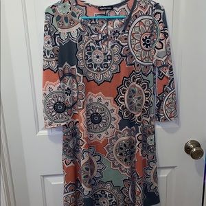 Women’s dress with criss cross neckline. Hemish S